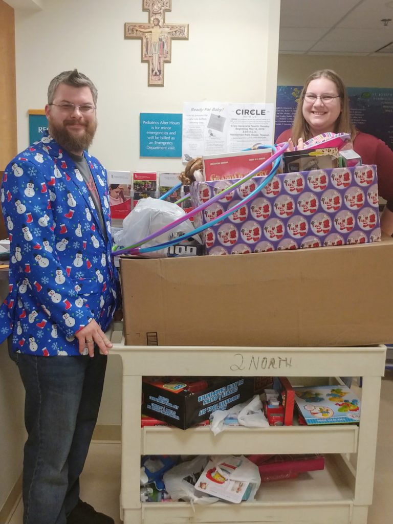Justin Wingerd delivering toys from the WTB toy drive to St. Joseph's Medical Center Pediatrics Hospital.