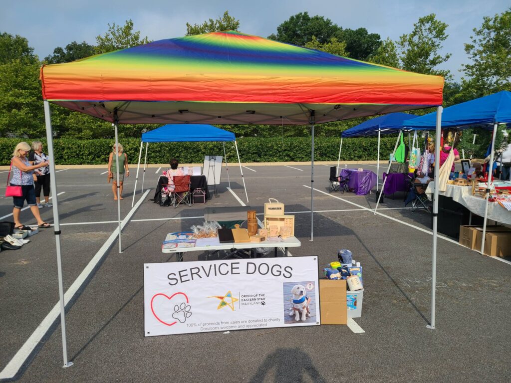 Tent at a flea market supporting service dogs